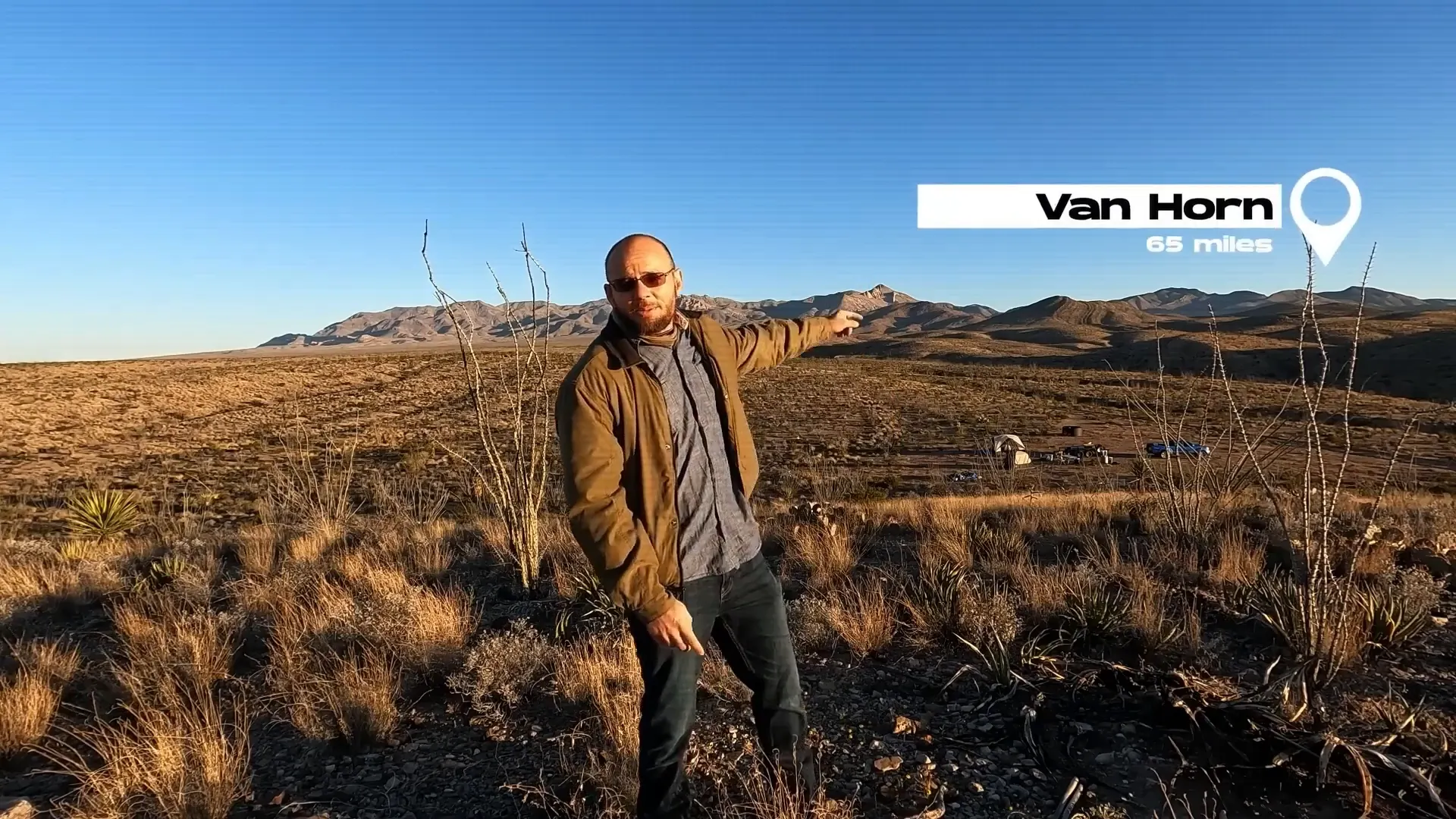 Sean Overton pointing out "Van Horn 65 miles" in the distance to demonstrate how isolated the land he aims to transform is.